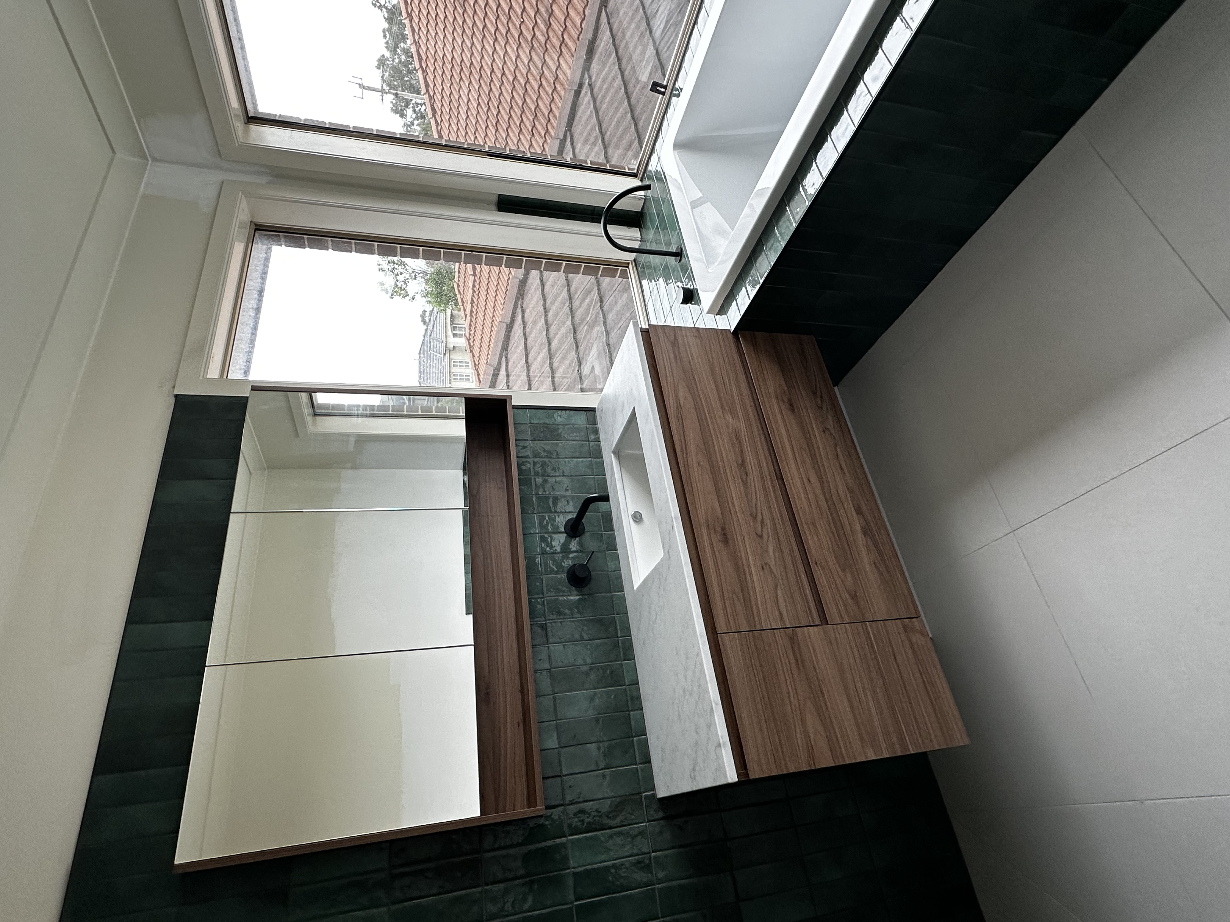 Bathroom vanity and shaving cabinet are great for storage of toiletries