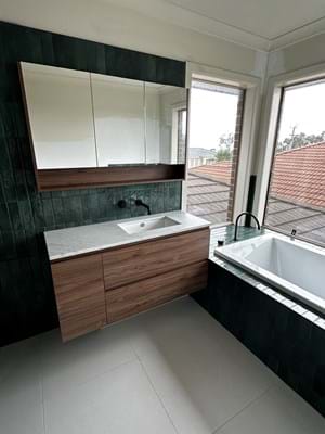 Bathroom vanity and shaving cabinet are great for storage of toiletries